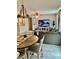 Open living room featuring a dining area, cozy seating, stylish lighting, and a large TV for entertainment at 1349 Sunset Blvd, Avon, IN 46123