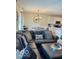 Open living space featuring a large L-shaped sofa, dining area, and kitchen at 1349 Sunset Blvd, Avon, IN 46123