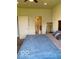 Spacious main bedroom with a view to the ensuite bath, neutral carpet and ceiling fan at 1349 Sunset Blvd, Avon, IN 46123