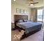 Spacious main bedroom with a large window, neutral carpet and ceiling fan at 1349 Sunset Blvd, Avon, IN 46123