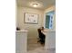 Cozy office space with white walls, built in desk and bright light fixture at 1349 Sunset Blvd, Avon, IN 46123