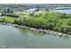 Aerial shot highlights a long row of boat docks lining the waterfront with homes nearby, offering convenient access to the water at 13909 Waterway Blvd, Fishers, IN 46040