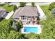 Aerial view of a beautiful home with a large backyard and a sparkling pool surrounded by lush landscaping at 13909 Waterway Blvd, Fishers, IN 46040