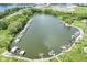 Aerial view of a lake showcasing multiple docks, green spaces, and waterfront access, perfect for boating and outdoor enthusiasts at 13909 Waterway Blvd, Fishers, IN 46040