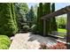 Beautiful backyard retreat with a wooden swing, brick pathway, and manicured landscaping at 13909 Waterway Blvd, Fishers, IN 46040
