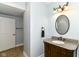 Charming bathroom with granite counters, wood vanity, updated faucet, and sconce lighting at 13909 Waterway Blvd, Fishers, IN 46040