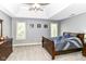 Bedroom featuring a bed, dresser, three windows with blinds, carpet, and sports decor at 13909 Waterway Blvd, Fishers, IN 46040