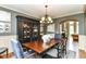 Formal dining room with a large wooden table, stylish chandelier, and elegant decor at 13909 Waterway Blvd, Fishers, IN 46040