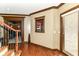 Spacious hallway boasts hardwood floors, rich trim, and a convenient concession window to the adjacent home theater at 13909 Waterway Blvd, Fishers, IN 46040