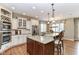 Well-equipped kitchen with granite countertops, custom cabinets, and stainless steel appliances at 13909 Waterway Blvd, Fishers, IN 46040