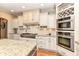 Bright kitchen with granite countertops, stainless steel appliances, and custom cabinetry at 13909 Waterway Blvd, Fishers, IN 46040