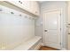 Functional mudroom with built-in bench, hooks, and storage cabinets at 13909 Waterway Blvd, Fishers, IN 46040