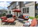 Outdoor patio area with comfortable seating, a grill, and an umbrella at 13909 Waterway Blvd, Fishers, IN 46040