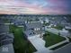 Picturesque aerial view of a home nestled in a residential neighborhood at twilight at 16598 Dominion Dr, Fortville, IN 46040