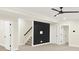 Finished basement area with neutral carpet and a black accent wall at 16598 Dominion Dr, Fortville, IN 46040