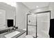 Modern bathroom with a shower, sink, black hardware, and neutral paint at 16598 Dominion Dr, Fortville, IN 46040