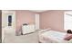 Comfortable bedroom with a twin bed, dresser, and soft carpet flooring at 16598 Dominion Dr, Fortville, IN 46040