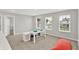Bright bonus room with three windows and a play table, perfect for Gathering time at 16598 Dominion Dr, Fortville, IN 46040