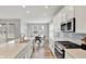 Eat-in kitchen features stainless appliances, white cabinets, and a dining area with bright windows at 16598 Dominion Dr, Fortville, IN 46040