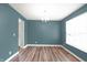 Dining room with wood floors, a chandelier, and a large window with bright natural light at 16598 Dominion Dr, Fortville, IN 46040