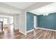 Spacious room with wood floors, a modern chandelier, and an elegant design at 16598 Dominion Dr, Fortville, IN 46040