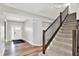 Inviting entryway with hardwood floors and a staircase leading to the upper level at 16598 Dominion Dr, Fortville, IN 46040