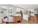 Open-concept kitchen and breakfast nook with stainless steel appliances and natural light at 16598 Dominion Dr, Fortville, IN 46040
