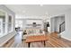 Inviting living space seamlessly connects the kitchen and dining, bathed in natural light with hardwood floors at 16598 Dominion Dr, Fortville, IN 46040