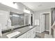 The main bathroom has a double sink vanity, and a glass enclosed shower at 16598 Dominion Dr, Fortville, IN 46040