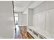 Mud room with coat hooks, bench, storage shelves, and durable flooring at 16598 Dominion Dr, Fortville, IN 46040