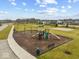 Community playground with slides, swings, and benches offers a fun recreation area at 16598 Dominion Dr, Fortville, IN 46040