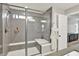 Stylish walk-in shower with tiled walls, bench seating, and a glass enclosure at 16598 Dominion Dr, Fortville, IN 46040