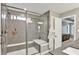 Walk-in shower with tiled walls and bench seating, adjacent to the Primary bathroom at 16598 Dominion Dr, Fortville, IN 46040