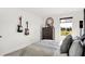 Cozy bedroom with guitars on the wall, a stylish mirror, and a bright window with a view of nature at 1725 Hemlock Cir, Greenfield, IN 46140