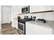 Well-equipped kitchen features stainless steel appliances, sleek countertops, and ample white cabinet space at 1725 Hemlock Cir, Greenfield, IN 46140