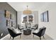 Cozy living room with wallpaper, neutral carpet, modern fixtures, and large window at 1725 Hemlock Cir, Greenfield, IN 46140