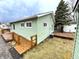 Backyard showcasing the exterior, including a wooden deck and lush greenery, providing a private outdoor space at 1801 Bauer Rd, Indianapolis, IN 46218