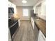Modern kitchen featuring wood countertops, stainless steel appliances, and ample cabinet space at 1801 Bauer Rd, Indianapolis, IN 46218