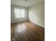Cozy bedroom with hardwood floors and natural light at 1844 N Riley Ave, Indianapolis, IN 46218
