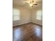 Bright bedroom with hardwood flooring and a ceiling fan at 1844 N Riley Ave, Indianapolis, IN 46218