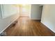 A large living room featuring wood floors and natural light at 1844 N Riley Ave, Indianapolis, IN 46218