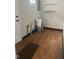 Spacious utility room with laminate flooring and white shelving at 1844 N Riley Ave, Indianapolis, IN 46218