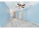 Bright bedroom with neutral carpet, ceiling fan, and walk-in closet at 19061 Fairfield Blvd, Noblesville, IN 46060