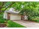 Charming two-story home with a brick facade, attached two-car garage, and mature landscaping at 19061 Fairfield Blvd, Noblesville, IN 46060