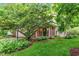 Well-maintained home with a green lawn and mature tree shading the front yard at 19061 Fairfield Blvd, Noblesville, IN 46060