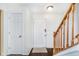 Foyer with dark wood floors, white trim, and staircase at 19061 Fairfield Blvd, Noblesville, IN 46060