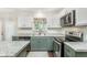 Updated kitchen with stainless steel appliances, granite countertops, and stylish cabinets at 19061 Fairfield Blvd, Noblesville, IN 46060