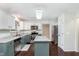 Bright kitchen features modern appliances, stone countertops, and wood flooring at 19061 Fairfield Blvd, Noblesville, IN 46060