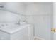 Practical laundry room with white shelving and a standard washer and dryer at 19061 Fairfield Blvd, Noblesville, IN 46060
