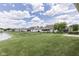 This wide backyard is picturesque with the community pond in the distance at 2025 Flamingo Way, Franklin, IN 46131